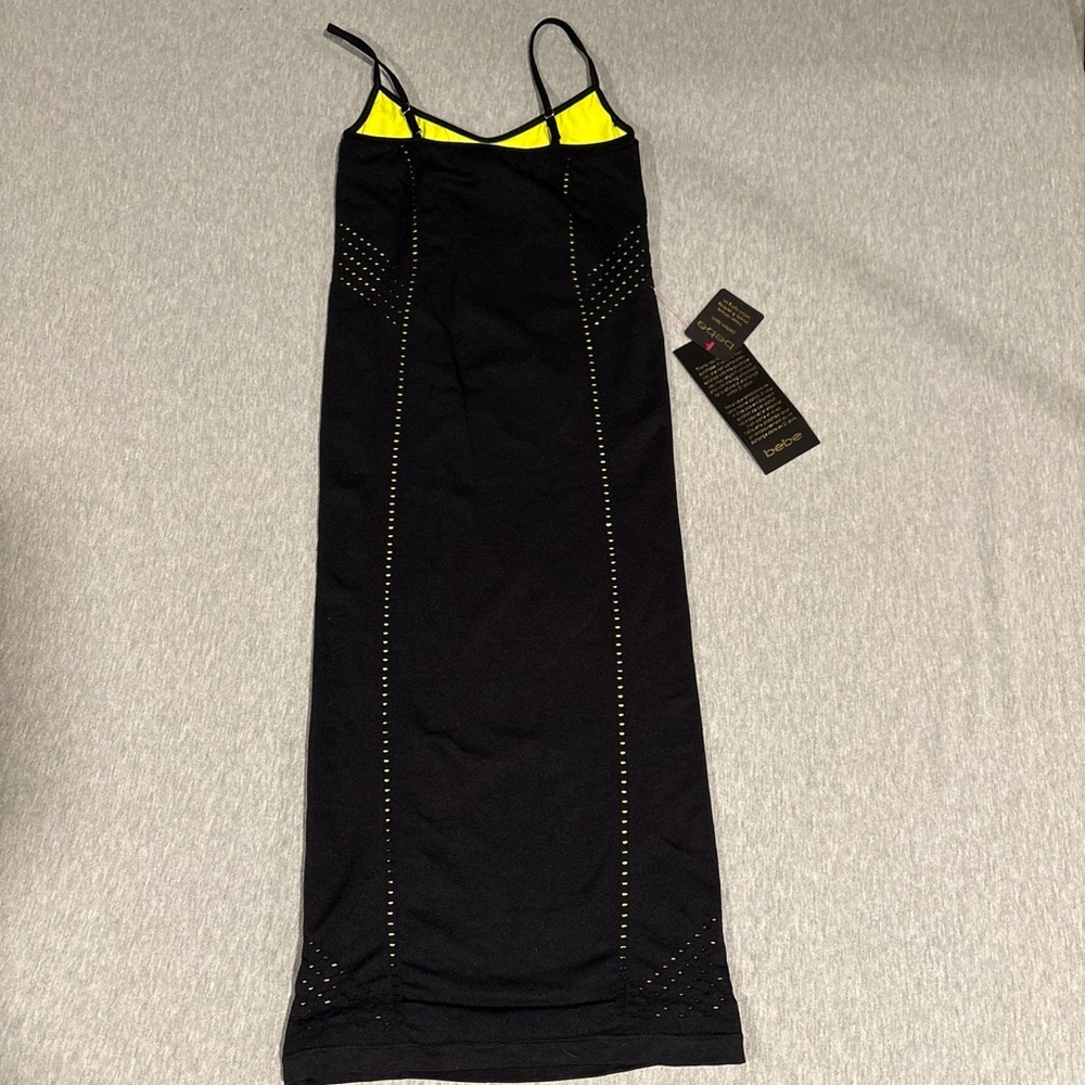 NWT BEBE Black Maxi Dress with perforations that show the neon lining